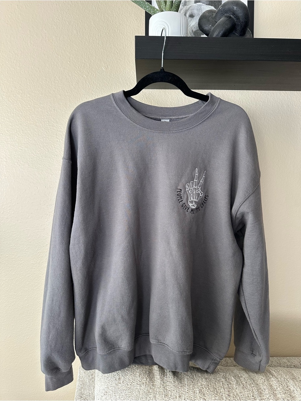 Gray Crewneck Sweatshirt with Skeleton Hand Graphic